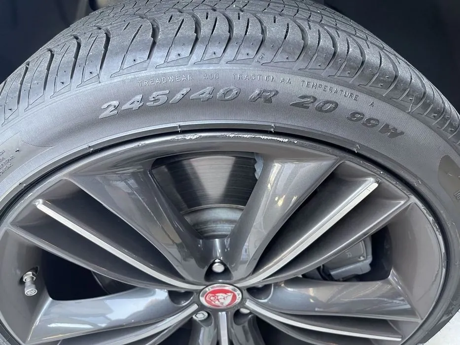 Wheel with curb rash before repair