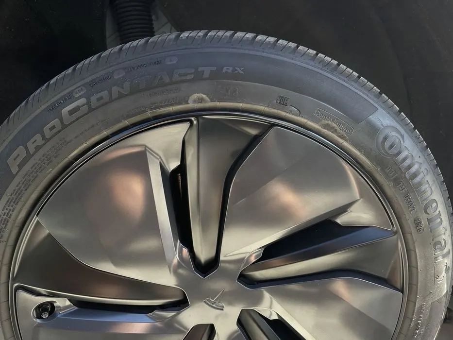 Same Tesla rim after refinishing, curb rash gone